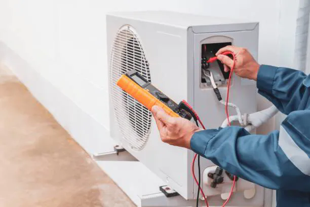 a person using a multimeter to test a device